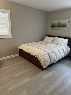 Room with queen sized bed.
