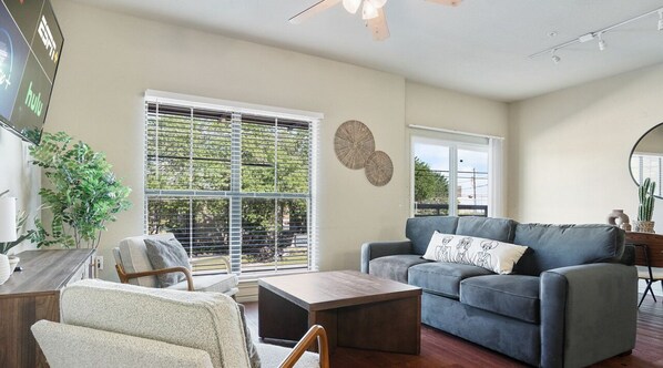 Spacious and open living and dining room with smart tv