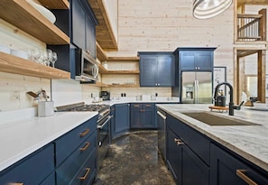 A chef's delight awaits in our state-of-the-art kitchen, where modern appliances meet rustic charm