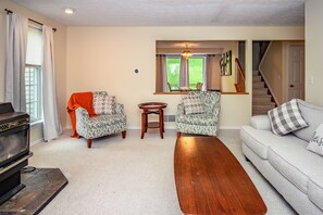 Comfortable living room has window to the kitchen and dining area