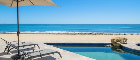 Incredible beachfront patio with pool and jacuzzi