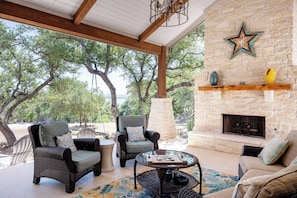 Outdoor living area, with outdoor tv, gas fireplace, and view of Canyon Lake!