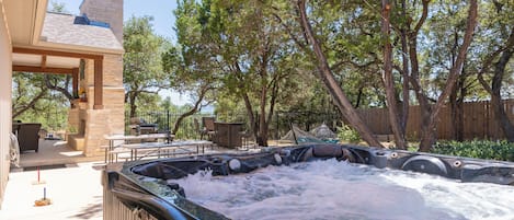 Private hot tub with view of the back yard area.
