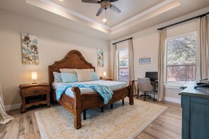 Master bedroom with king bed, walk-in closet, and en-suite master bathroom.