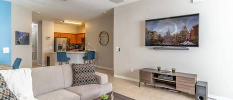 Spacious living room with open floor plan connecting to the kitchen