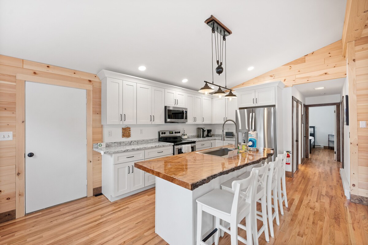 Lake-view home with large deck, grill, lawn, & mtn views – dog-friendly