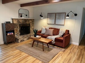 Family room with games (attached to sun room) that leads to patio & backyard.