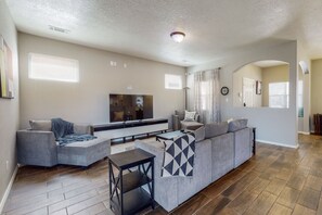 Living Room with plenty of seating and Smart TV