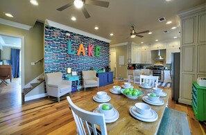 Main Floor Fully-Stocked Kitchen: From brightly colored nautical decor to the custom canoe wallpaper, this kitchen is a happy start to your day!