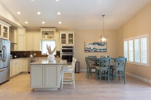 The open kitchen and dining room is great for visiting with friends and family. 