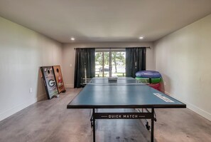 Lower-Level · Access to Backyard · Ping Pong · Video Games · Arcade Games · Smart TV · Kitchenette · Full Bathroom · WiFi · Love Seat 