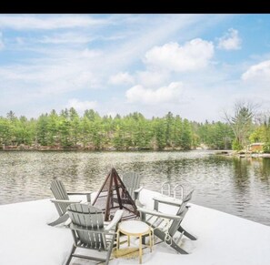 The large crib dock houses a chalet style fire pit and is large enough for 10+