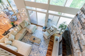 Views of the 2-story family room from the 2nd-floor balcony.