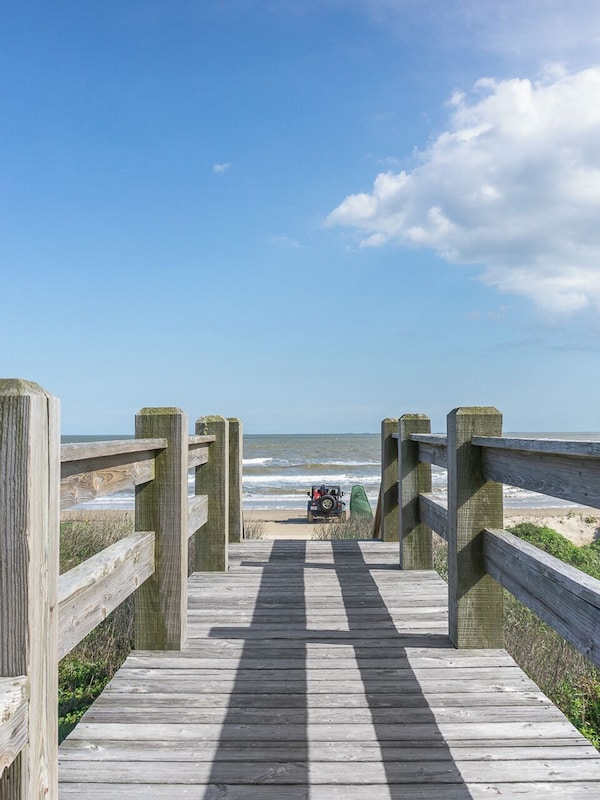 Community dune bridge deck connected to the property to get to the beach.