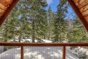 Step outside and enjoy the fresh mountain air and surrounding forest views from one of the home’s two private outdoor areas.