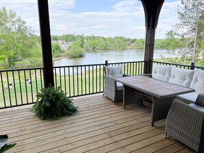 Upstairs porch with dining table that comfortably sits 5