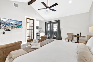 Cozy king bed with flat screen TV.