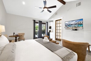 Cozy king bed with flat screen TV.
