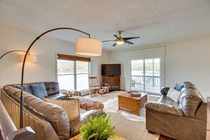 Living Room | Smart TV | Central Heating & A/C | Ceiling Fans | Deck Access