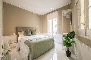 View of the bedroom with a double bed and exterior window