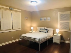 Relax in serenity in the "My Happy Place" beach-themed room with 32" Roku TV!