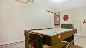Games Area which has an electronic dart board and Pool Table
