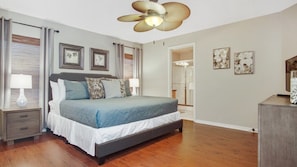 Bedroom 1 - Master with King bed, 32" flat screen Smart TV, ceiling fan, views of the pool, en-suite