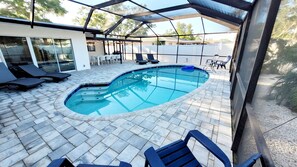 This large pool and spacious patio will make it hard to decide if you want to go to the beach or stay in.
