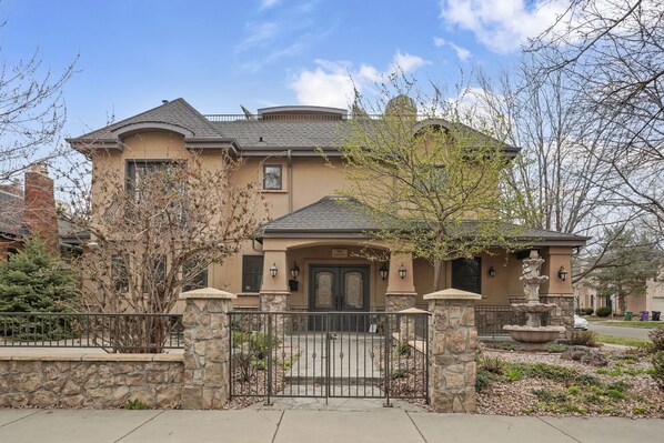 Front with gated entrance and wrap around patio