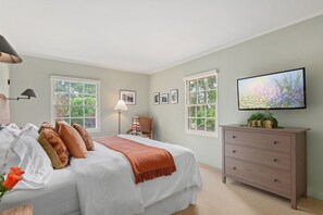 Primary bedroom with TV in main house