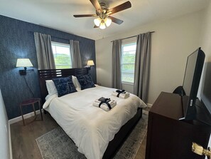 queen size bedroom with smart tv