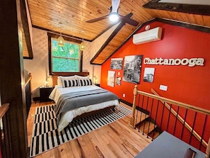 Sleeping loft with queen bed in the Wauhatchie Train Depot at Wauhatchie Woodlands in Chattanooga, TN