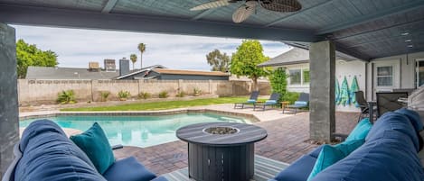 Welcome to our cozy back yard complete with plenty of comfortable seating and a sparkling heated pool!