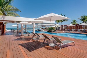 Lots of sun loungers around the pool