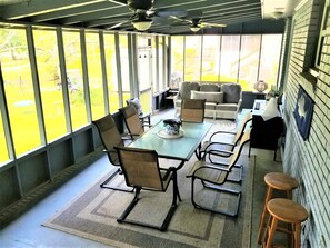 Large Main Screened Porch with entry from Dining room and Kitchen