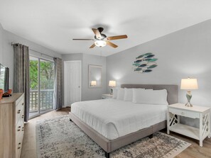 Primary Bedroom with King Bed and Access to Patio