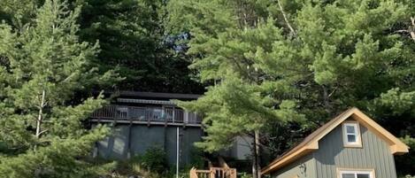 View of guest cottage and lakeside cabana from the lake