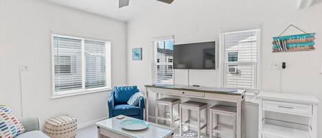 Living room with smart TV and ceiling fan