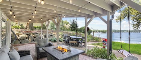 Backyard patio with firepit table, dining table, giant Jenga, and SUNSET VIEWS!