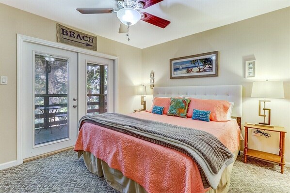 Primary Bedroom with King Bed and Access to Screened-In Porch