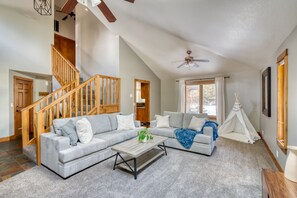 Living room with sleeper sofa and play teepee for kids