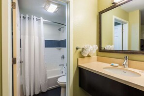 Full bathroom with a shower/tub. Basic toiletries and towels are provided