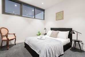 1st Floor Bedroom: In the bedroom, there is a comfortable queen-sized bed with a side table and wardrobe.