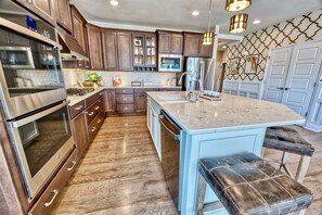 Chef-inspired kitchen features stainless steel appliances