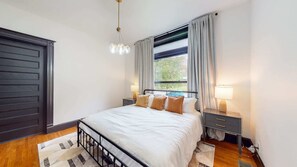 Our master bedroom has a comfy queen-sized bed with high-quality sheets and a soft comforter that's perfect for lounging all day.