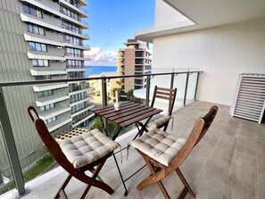 A private balcony with comfortable outdoor seating