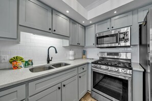 Quartz Countertops, Stainless Steel Sink, and Samsung Steel Appliances