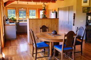 dining room and kitchen with panoramic views of the ranch
