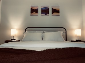 Warm lighting on each bedside table or bright daylight in the overhead light.