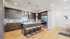 Spacious kitchen with a family-welcoming island size.